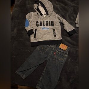 12 month Calvin Klein sweater and Levi jeans